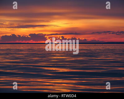 Red dramatic sunset on the sea Stock Photo
