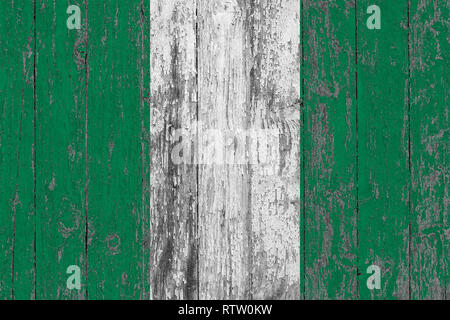 Flag of Nigeria painted on worn out wooden texture background. Stock Photo