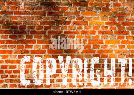 Word writing text Copyright. Business concept for Saying no to intellectual property piracy Brick Wall art like Graffiti motivational call written on  Stock Photo