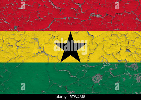 Flag of Ghana painted on cracked dirty wall. National pattern on vintage style surface. Stock Photo