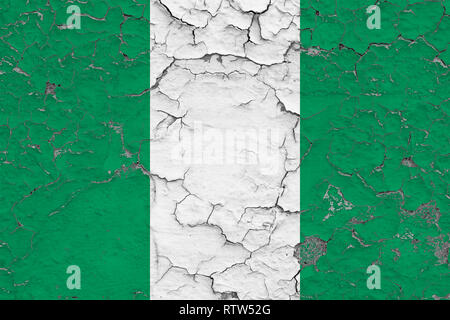 Flag of Nigeria painted on cracked dirty wall. National pattern on vintage style surface. Stock Photo