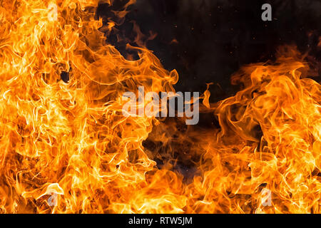 intense orange fire flames textureon black background Stock Photo