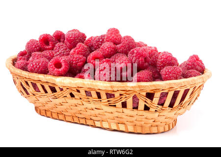 red raspberries in a wicker basket isolated Stock Photo