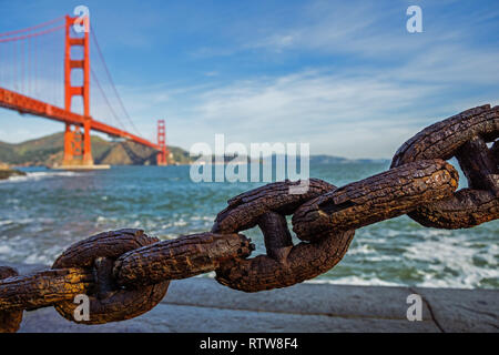 Old rusted chain in front of Golden Gate bridge in San Francisco Stock Photo