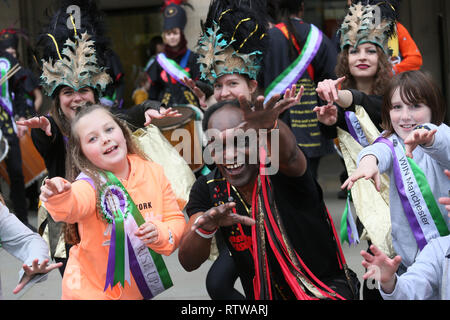 Manchester, UK. 2nd March 2019. The Lord Mayor, Councillor June Hitchen  leads the Walk for Women to celebrate International Women's Day with people wearing sashes and rosettes with the words 'Rise Up Women'.  Several women's organisations are taking part in the march from St peters Square to the castlefield basin where radical singer song writer Claire Mooney is hosting a rally.   Manchester,  UK, 2nd March 2019 (C)Barbara Cook/Alamy Live News Stock Photo