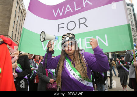 Manchester, UK. 2nd March 2019. The Lord Mayor, Councillor June Hitchen  leads the Walk for Women to celebrate International Women's Day with people wearing sashes and rosettes with the words 'Rise Up Women'.  Several women's organisations are taking part in the march from St peters Square to the castlefield basin where radical singer song writer Claire Mooney is hosting a rally.   Manchester,  UK, 2nd March 2019 (C)Barbara Cook/Alamy Live News Stock Photo