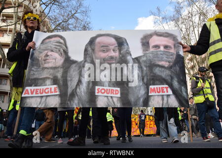 Toulouse, France. 2nd March 2019. The weekly serious clashes occured once more time on March the 2nd 2019  in the streets of Toulouse, France, between riot police units and the yellow vest (gilets jaunes). Police largely used tear gas. A banner showing from left to right Mr Castaner (Minister of the Interior), Mr Philippe (Prime Minister) and Mr Macron (President) . Credit: Corentin LE GALL/Alamy Live News Stock Photo