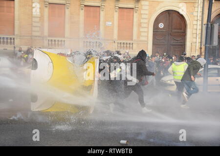 Toulouse, France. 2nd March 2019. The weekly serious clashes occured once more time on March the 2nd 2019  in the streets of Toulouse, France, between riot police units and the yellow vest (gilets jaunes). Police largely used tear gas. The police water cannon truck disperses the protesters. Credit: Corentin LE GALL/Alamy Live News