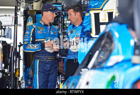 Hampton, GA, USA. 22nd Feb, 2018. Busch Beer Ford driver Kevin Harvick (left) talks with crew chief Rodney Childers (right) in the garage following a Monster Energy Cup Series practice on Friday at Atlanta Motor Speedway in Hampton, GA. Austin McAfee/CSM/Alamy Live News Stock Photo