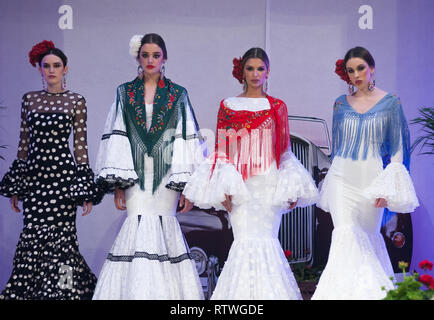 Malaga, MALAGA, Spain. 2nd Mar, 2019. Models seen wearing flamenco dresses posing for photographers on the catwalk during the IV International Flamenco Fashion Fair (FIMAF) at hotel NH in downtown city. Every year a new edition of the International Flamenco Fashion Fair happens, a meeting with designers to promote and present the pre-season flamenco fashion designs. The flamenco fashion industry is an economic engine from Andalusia, and its culture is recognized internationally. Credit: Jesus Merida/SOPA Images/ZUMA Wire/Alamy Live News Stock Photo