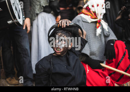 Luzon, Guadalajara, Spain. 2nd Mar, 2019. A child takes part of the carnival dress as a devil during the Devils of Luzon Carnival. Hundreds of people turn out to celebrate the ancient tradition of the Festival of Devils and Masked Figures. People dress like devils with bull horns, cowbells and paint thei body with black oil and soot. Revellers wear white masks. The tradition goes back to the 14th century. Credit: Bruno Thevenin/SOPA Images/ZUMA Wire/Alamy Live News Stock Photo