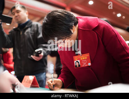 Beijing, China. 3rd Mar, 2019. Tian Chunyan, a deputy to the 13th National People's Congress (NPC) from Beijing, registers at Beijing Conference Center in Beijing, capital of China, March 3, 2019. The second session of the 13th NPC will convene on March 5. Credit: Jin Liwang/Xinhua/Alamy Live News Stock Photo