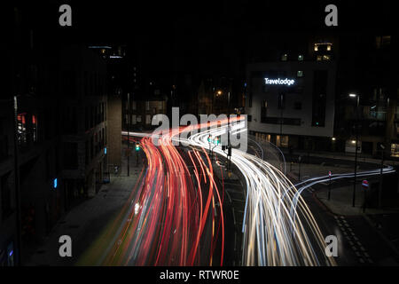 Lewisham night London street with passing cars Stock Photo