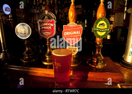 Festival, weekend, glass, pint, labels, pumps, pump, hand, pulleBeer, pumps, Real Ale, Larger, The Woodvale, Pub, Gurnard, Isle of Wight, England, UK, Stock Photo