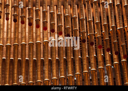 Shanghai, China - August 3, 2018: Golden Pipes, Decoration Waves of Modern Architecture. Shinning Bamboo Shaped. Stock Photo