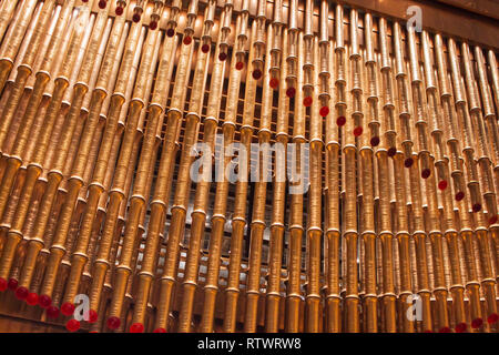 Shanghai, China - August 3, 2018: Golden Pipes, Decoration Waves of Modern Architecture. Shinning Bamboo Shaped. Stock Photo