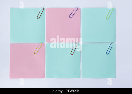 three blank sheets with paper clips isolated on white background.photo with copy space Stock Photo