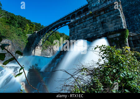 Dam controlling the flow of water. Stock Photo