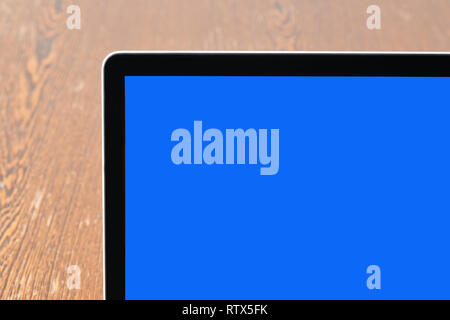 Modern laptop on textured wooden desk detail view. Path for screen Stock Photo