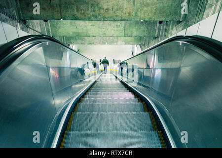 Metro escalator in Montreal, Canada - man going down Stock Photo
