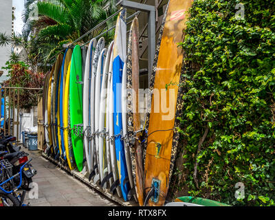 Surfboard rentals waiting for tourists in Waikiki on April 24, 2014 in Oahu. Waikiki beach is beachfront neighborhood of Honolulu, best known for whit Stock Photo