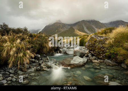 A view across a stream flowing through New Zealand's Hooker Valley on the South Island.