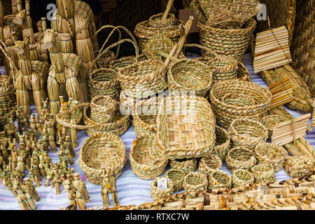 Totora crafts such as baskets, fans, animals and mats, handmade by artisans from Imbabura, Ecuador Stock Photo