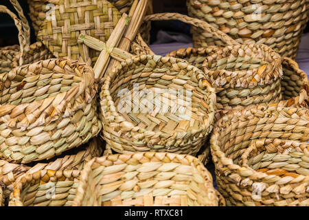 Totora crafts such as baskets, fans, animals and mats, handmade by artisans from Imbabura, Ecuador Stock Photo