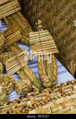 Totora crafts such as baskets, fans, animals and mats, handmade by artisans from Imbabura, Ecuador Stock Photo