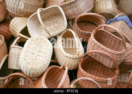 Group of empty wicker baskets for sale in a market place Stock Photo