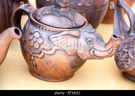 handmade pottery on display at street market in Crimea Stock Photo