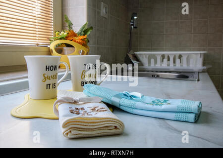 Part of the kitchen where cups and towels are placed Stock Photo