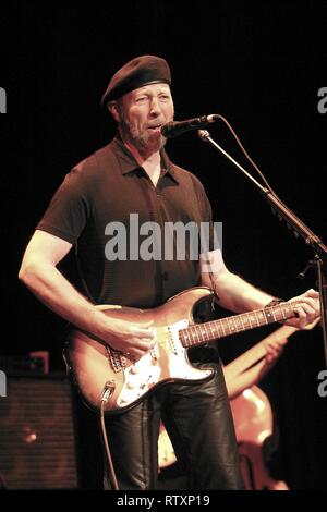 Singer, songwriter and guitarist Richard Thompson is shown performing on stage during 'live' concert appearance. Stock Photo