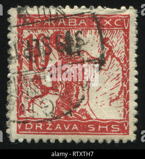 RUSSIA KALININGRAD, 12 NOVEMBER 2016: stamp printed by Yugoslavia, chain breaker, circa 1919 Stock Photo
