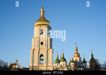 Kyiv (Kiev) is the capital of Ukraine. Bell tower of Saint Sophia's Cathedral against a clean blue sky. Sofia Square Stock Photo