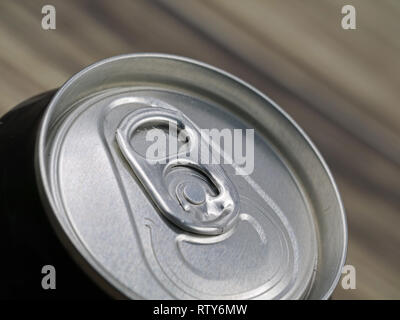 closeup of black aluminium can on blured wooden background Stock Photo
