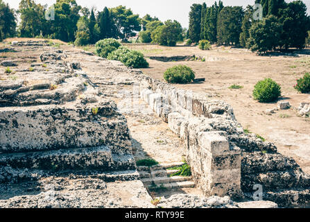 The Roman amphitheatre of Syracuse – ruins in Archeological park, Sicily, Italy Stock Photo