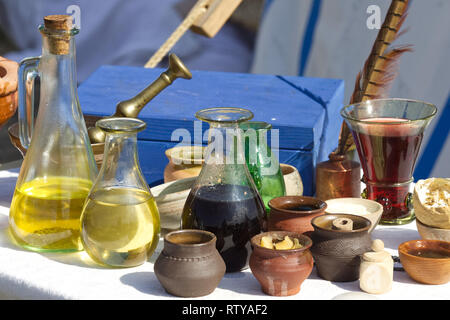 Table full of vinegar's, cooking oils and cooking wines in Medieval times Stock Photo