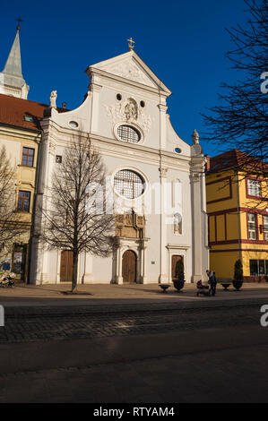 KOSICE, SLOVAKIA - FEBRUARY 14, 2019: facade of Franciscan Church on Hlavna Street in old town of Kosice, Slovakia Stock Photo