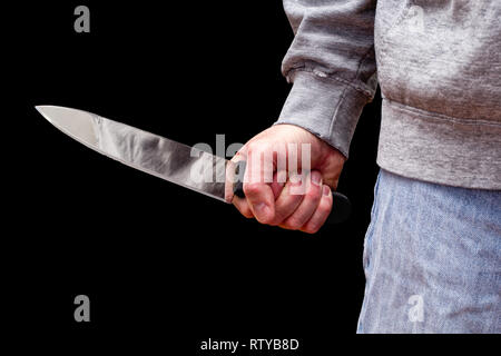 Man brandishing kitchen knife in a threatening manner. Isolated on ...