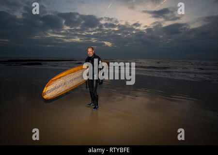 Surfer, Fill in Flash, Dusk, Compton Beach, Isle of Wight, England, UK, Stock Photo