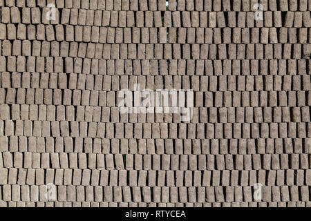 Adobes or bricks in the process of drying prior to being burned in a wood-burning oven Stock Photo