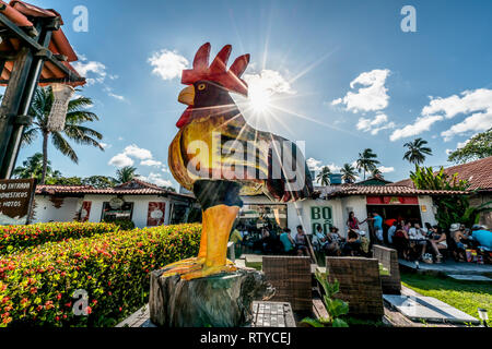 Porto de Galinhas beach, Ipojuca, Pernambuco, Brazil - September, 2018: Colorful chicken craft statues Stock Photo