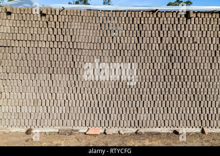 Adobes or bricks in the process of drying prior to being burned in a wood-burning oven Stock Photo