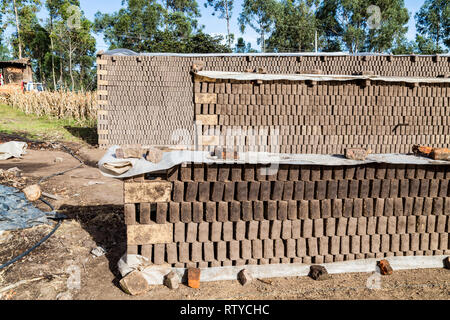 Adobes or bricks in the process of drying prior to being burned in a wood-burning oven Stock Photo