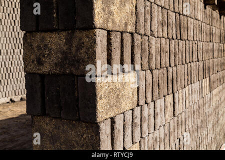 Adobes or bricks in the process of drying prior to being burned in a wood-burning oven Stock Photo