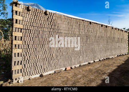 Adobes or bricks in the process of drying prior to being burned in a wood-burning oven Stock Photo