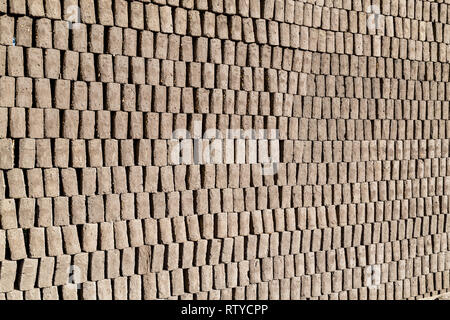 Adobes or bricks in the process of drying prior to being burned in a wood-burning oven Stock Photo