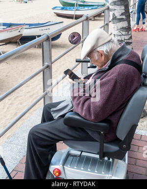 Elderly man using mobile phone Stock Photo