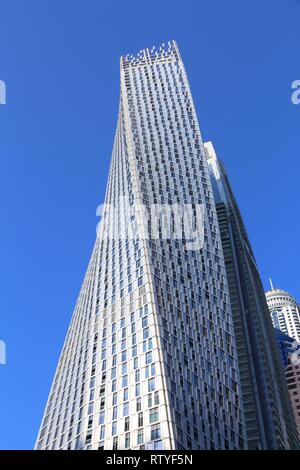 DUBAI, UAE - NOVEMBER 23, 2017: Cayan Tower building in Dubai Marina, UAE. The residential skyscraper was designed by Skidmore, Owings and Merrill and Stock Photo